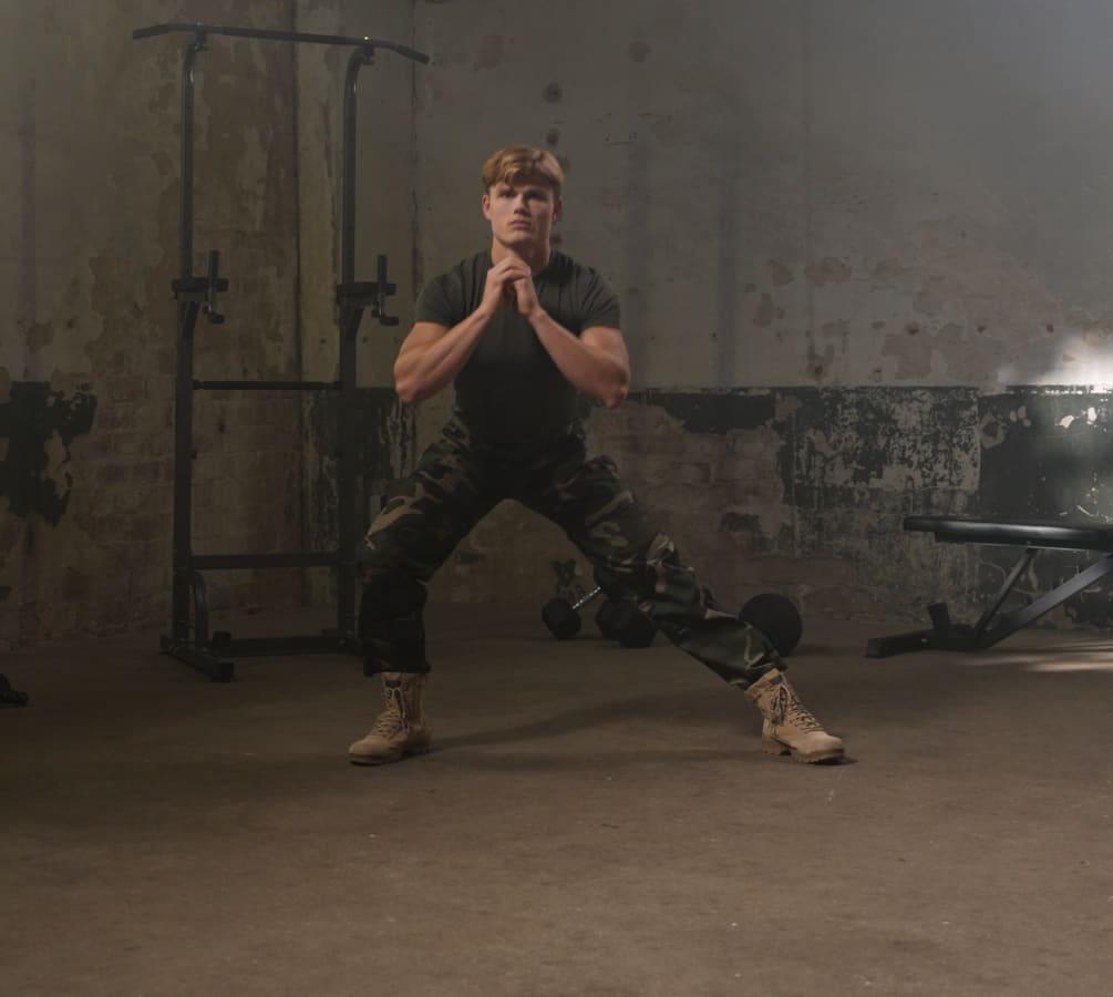 A woman lifting dumbbells during a strength session